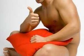 A man prepares for jelq - a penis enlargement exercise